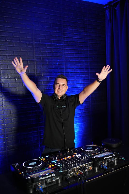 David Matson, arms raised at the decks